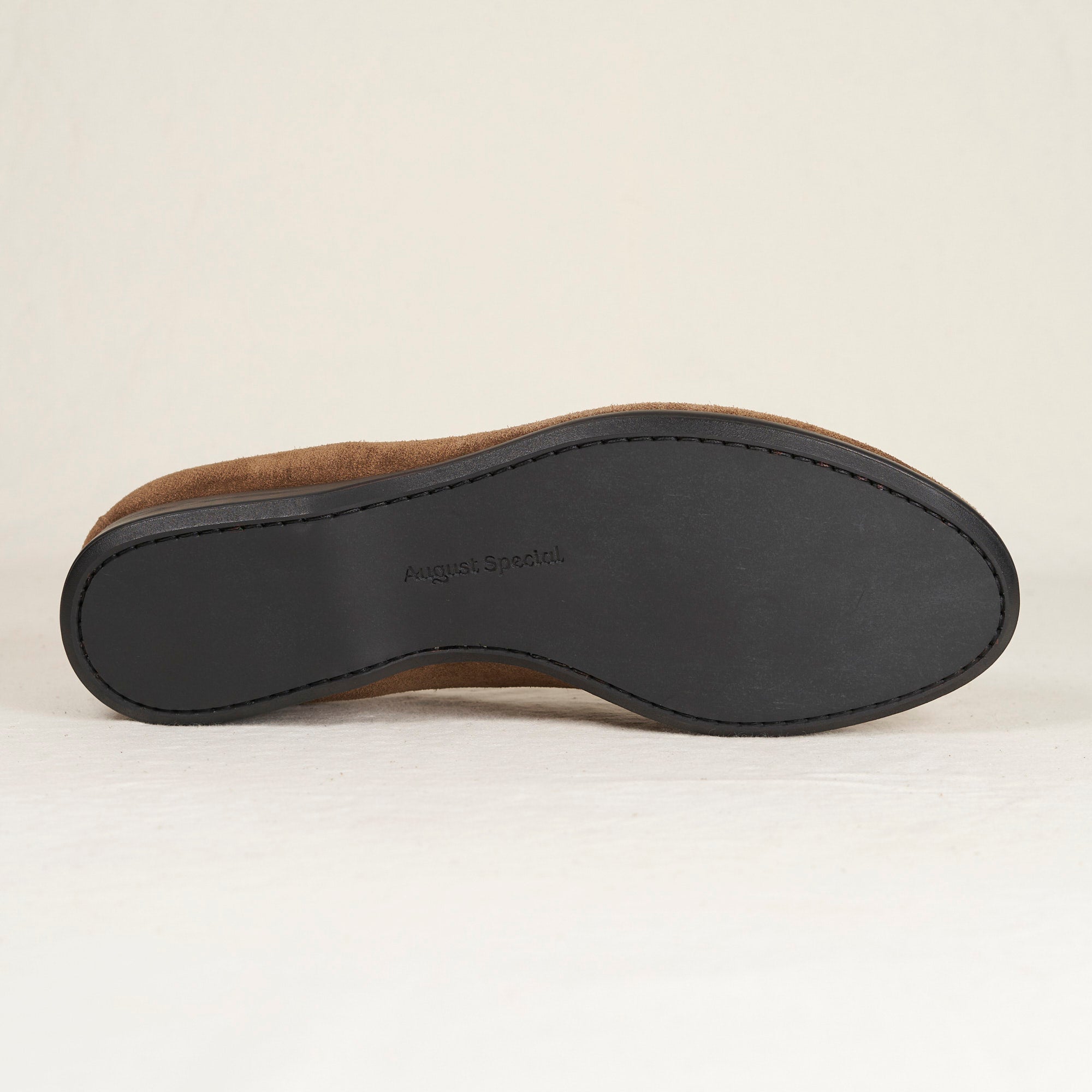 Sole view of August Special Augie Type-S tobacco calf suede loafer — Blake-stitched, rubber outsole.