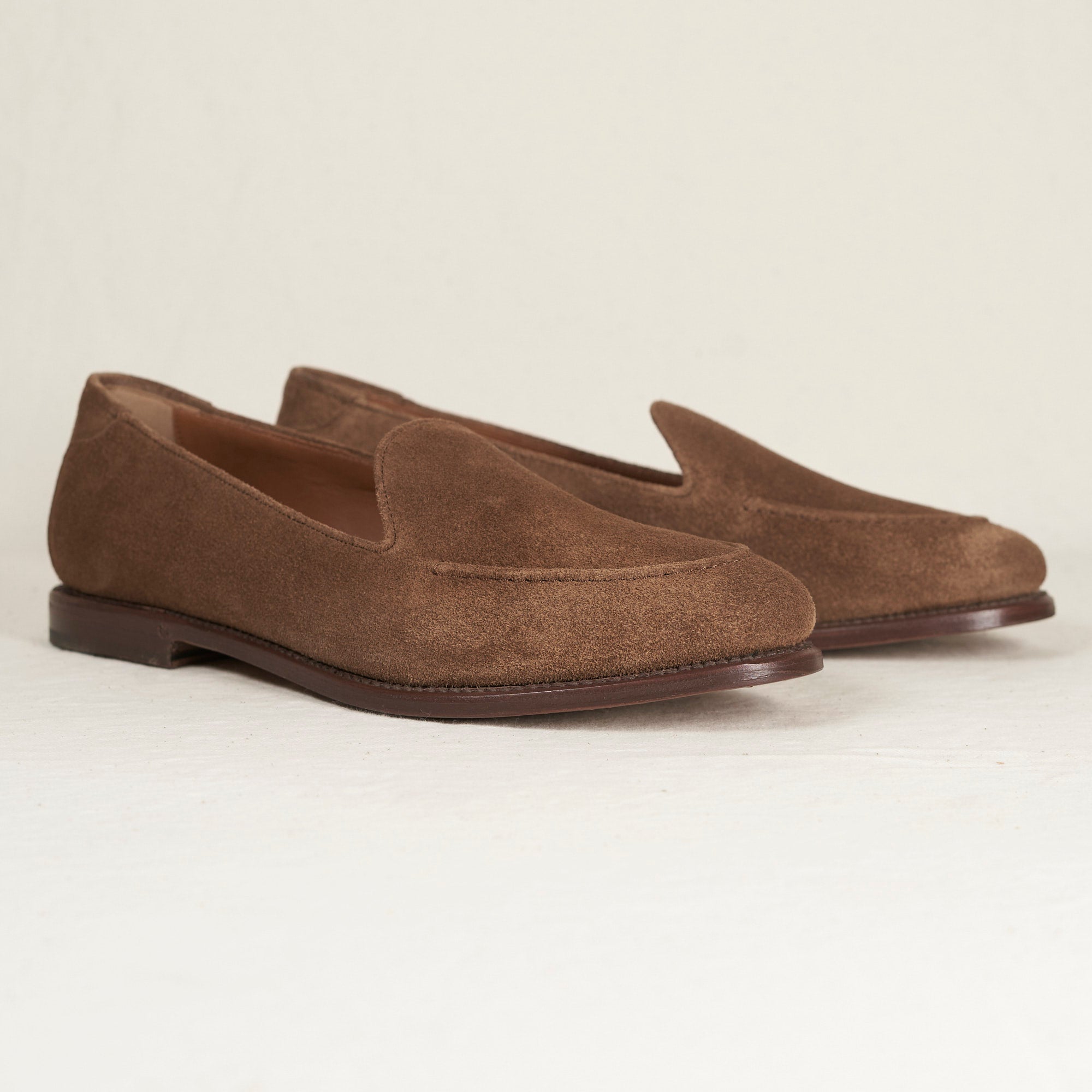 Angled view of August Special Augie Type-GS Cubano suede Goodyear slip-on — hand-sewn welt, cushioned Harry Last.