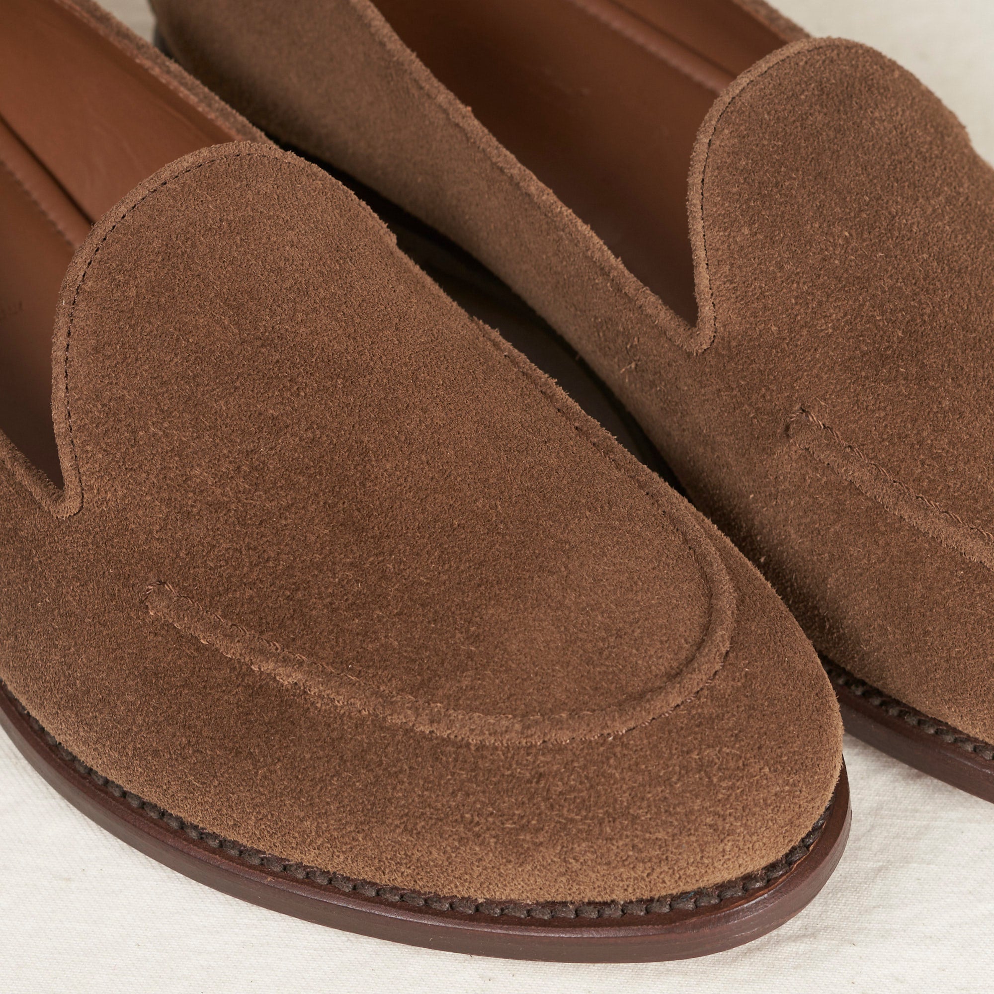 Close detail of cubano suede and Goodyear welt on the August Special Augie Type-GS men's slip-on loafer.