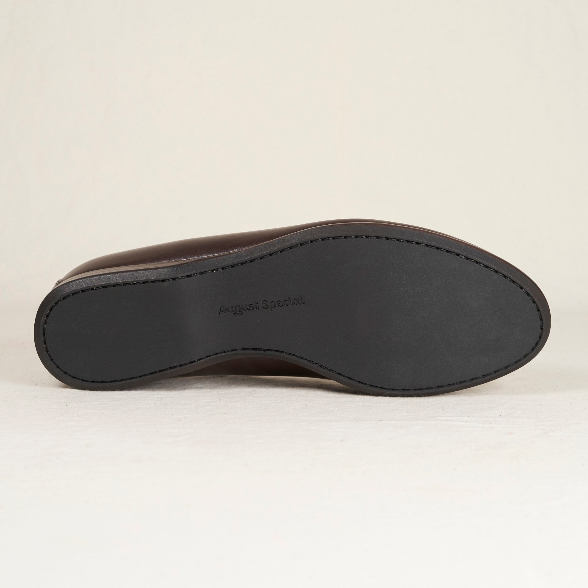Sole view of August Special Augie Type-S men's espresso veg-tan calf Blake loafer — Blake stitch, rubber outsole, Harry Last.
