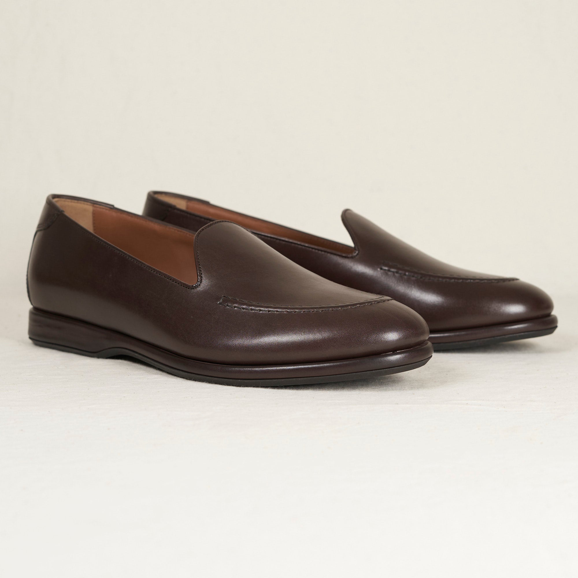 Angled view of August Special Augie Type-S espresso Maryam calf Blake loafer — hand-sewn vamp stitch, cushioned Harry Last.
