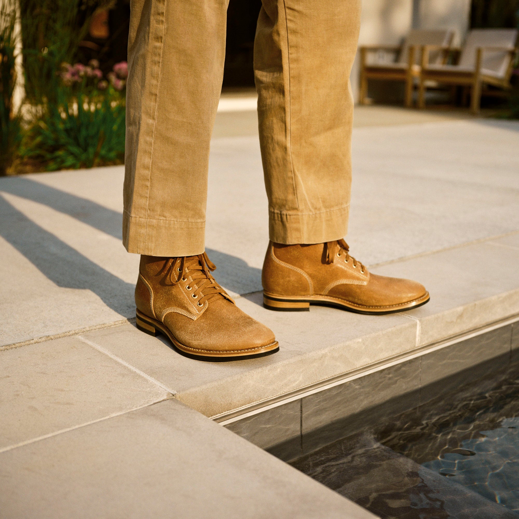 August Special - man by pool in vintage chinos with sueded and waxed Belliver horsehide boondocker boots