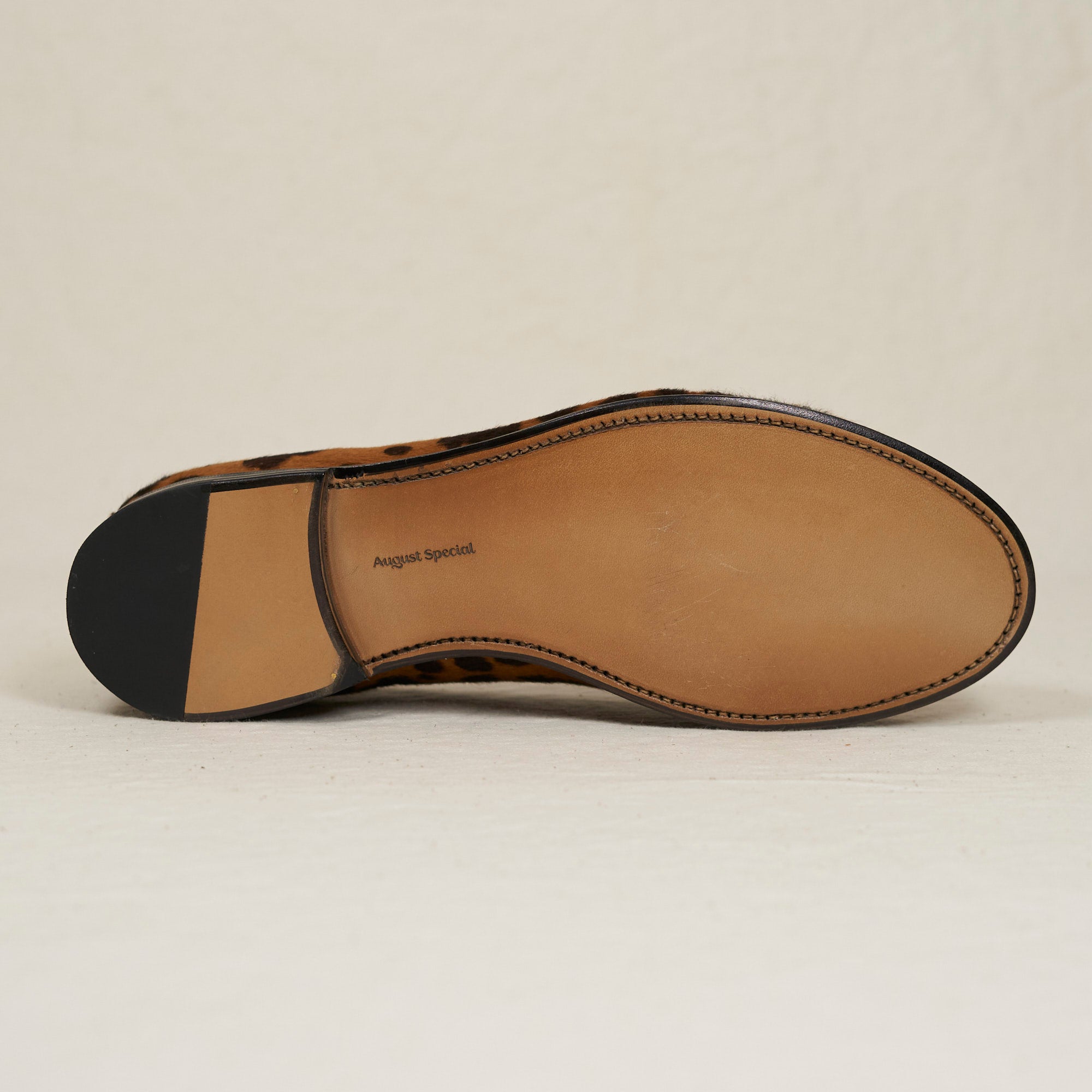 Sole view of August Special Augie Type-GP leopard haircalf Goodyear loafer — hand-sewn welt and veg-tan leather outsole.