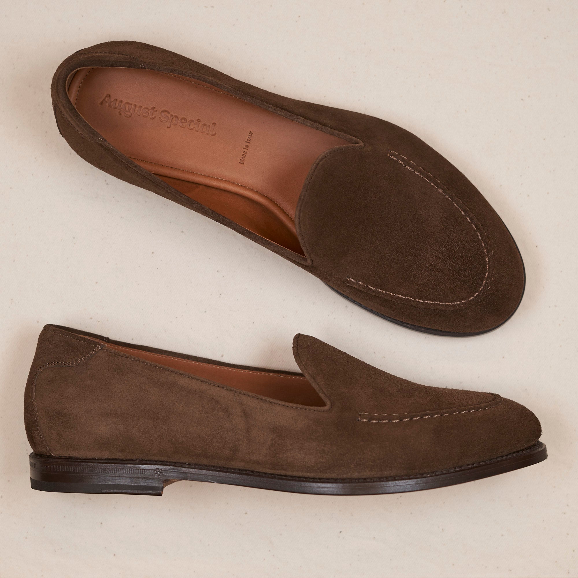 Lifestyle view of August Special Augie Type-GS men's chocolate suede Goodyear slip-on — classic American style.