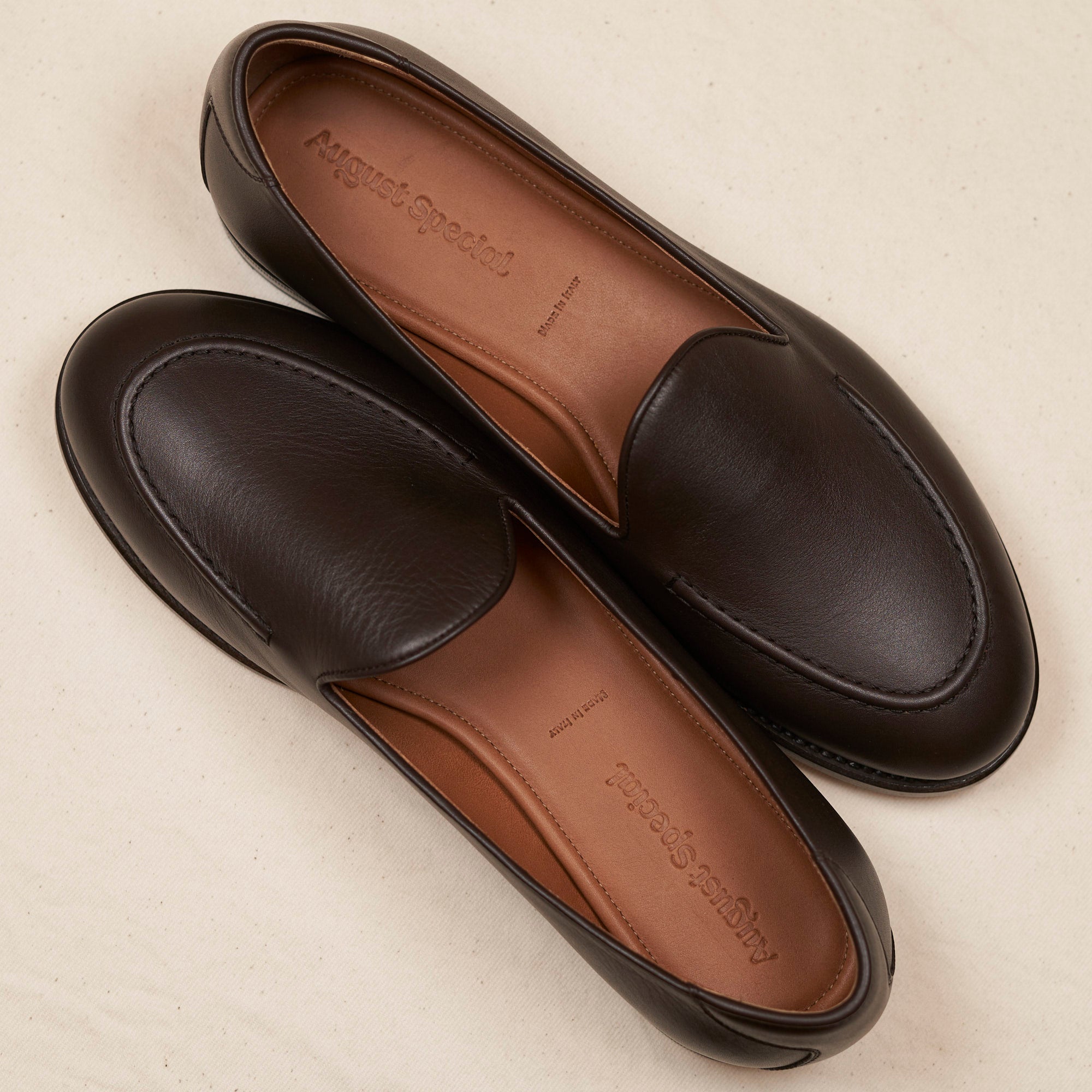 Pair of August Special Augie Type-GS men's espresso calf Goodyear slip-ons — luxurious comfort, classic American style.