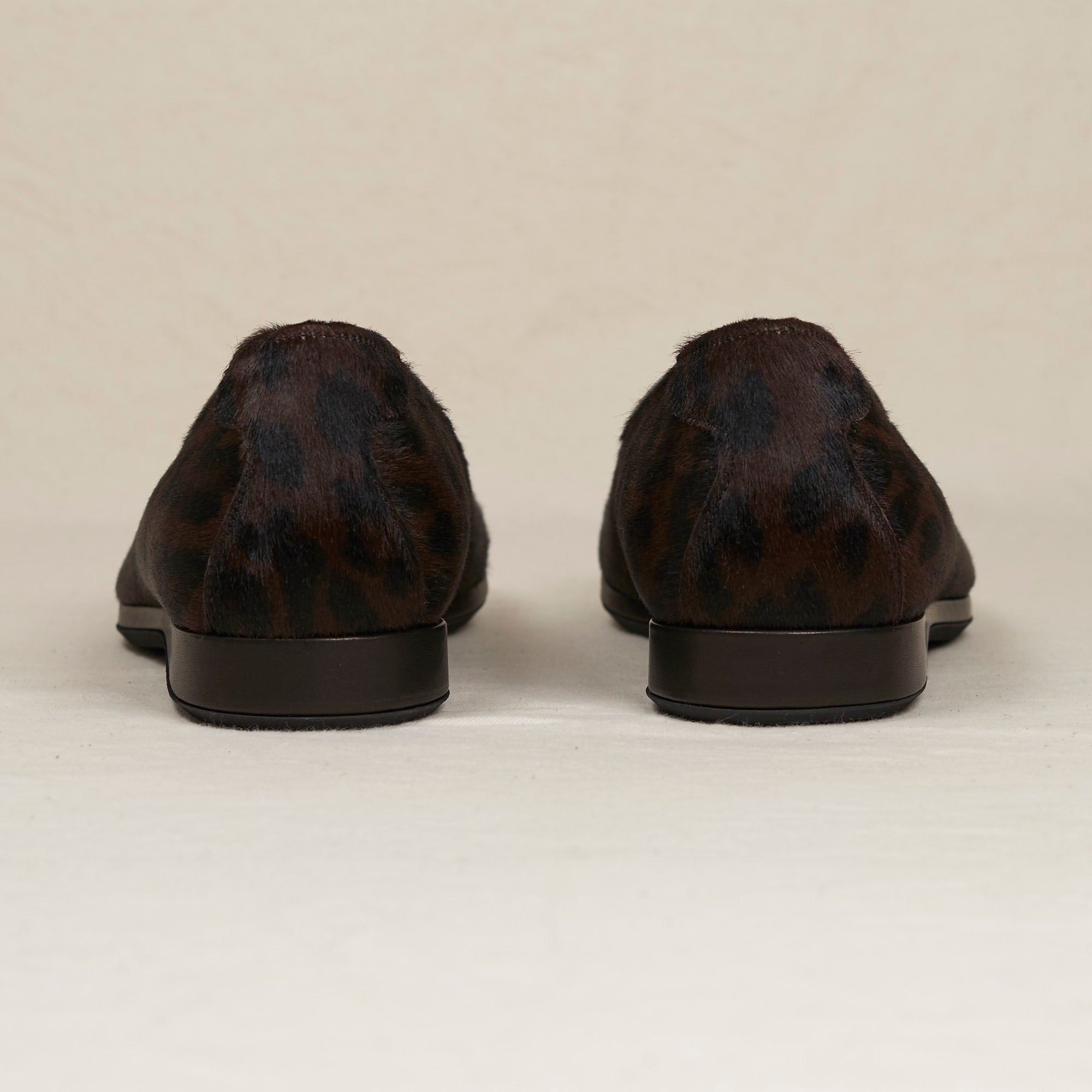 Back heel view of August Special Augie Type-P men's black leopard haircalf Blake loafer — cushioned insole, Harry Last.