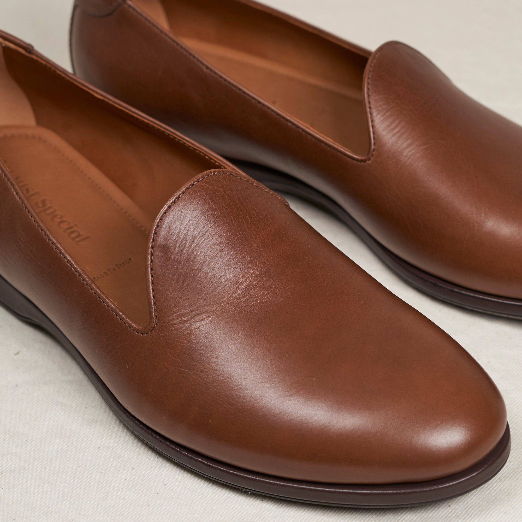 Close detail of cigar Maryam veg-tan calf and Blake-stitched outsole on the August Special Augie Type-P men's loafer.