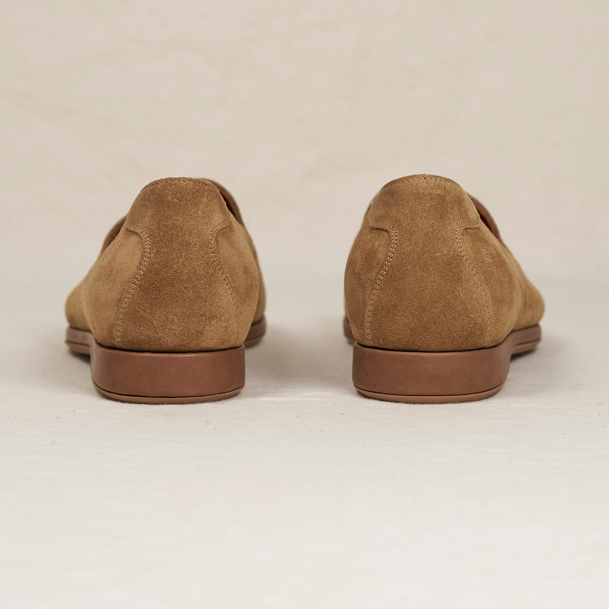 Back heel view of August Special Augie Type-P men's sand calf suede Blake loafer — cushioned insole, clean counter.