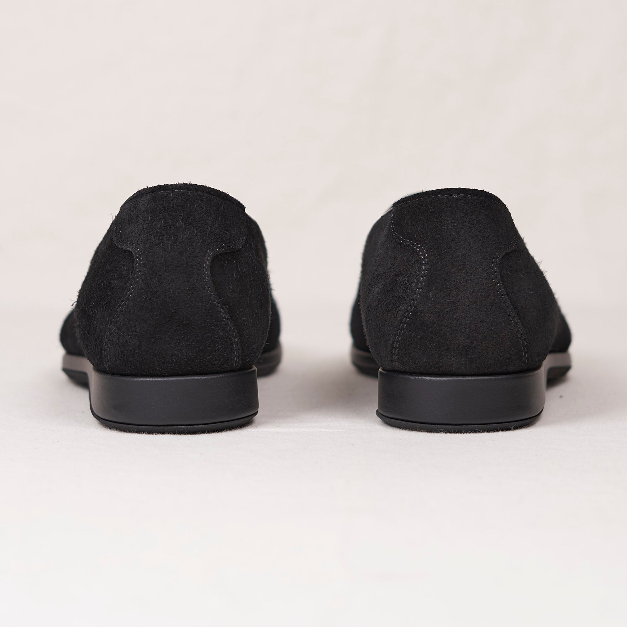 Sole view of August Special Augie Type-S black calf suede loafer — Blake-stitched rubber outsole and veg-tan leather welt.