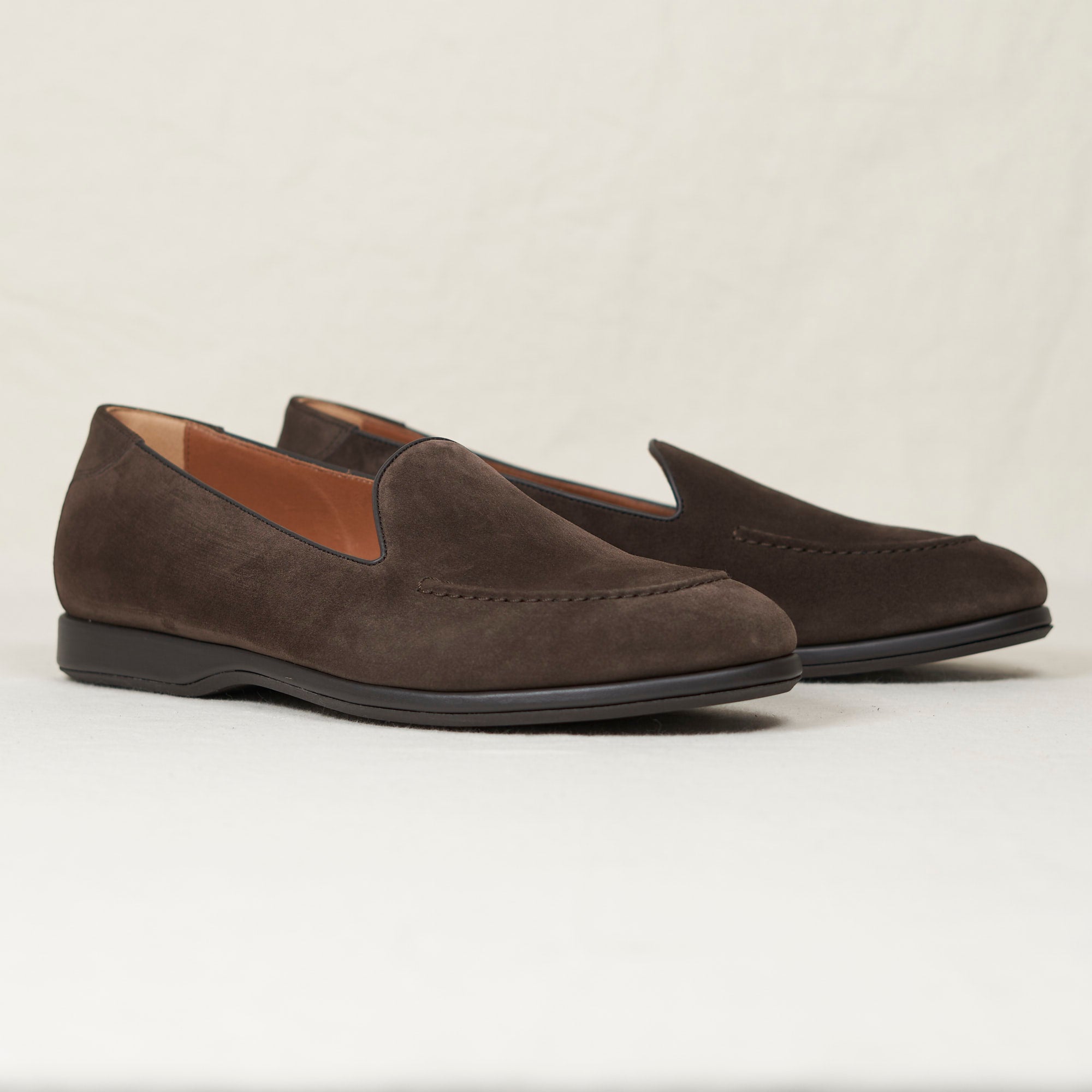 Angled view of August Special Augie Type-S earth calf suede Blake loafer — hand-sewn vamp stitch, cushioned Harry Last.