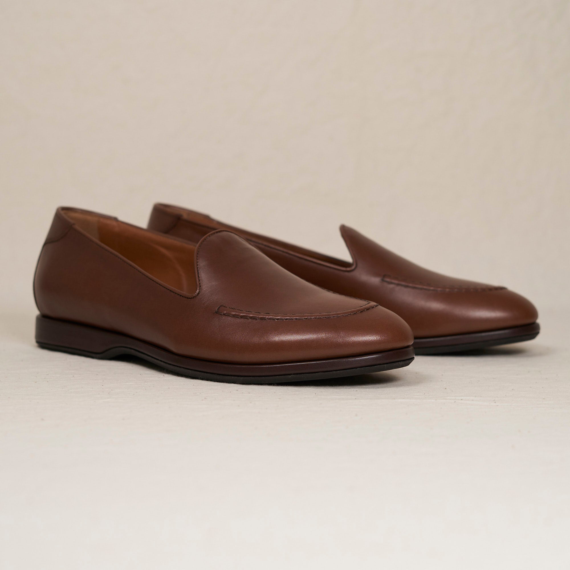 Angled view of August Special Augie Type-S maduro Maryam calf Blake loafer — hand-sewn vamp stitch, cushioned Harry Last.
