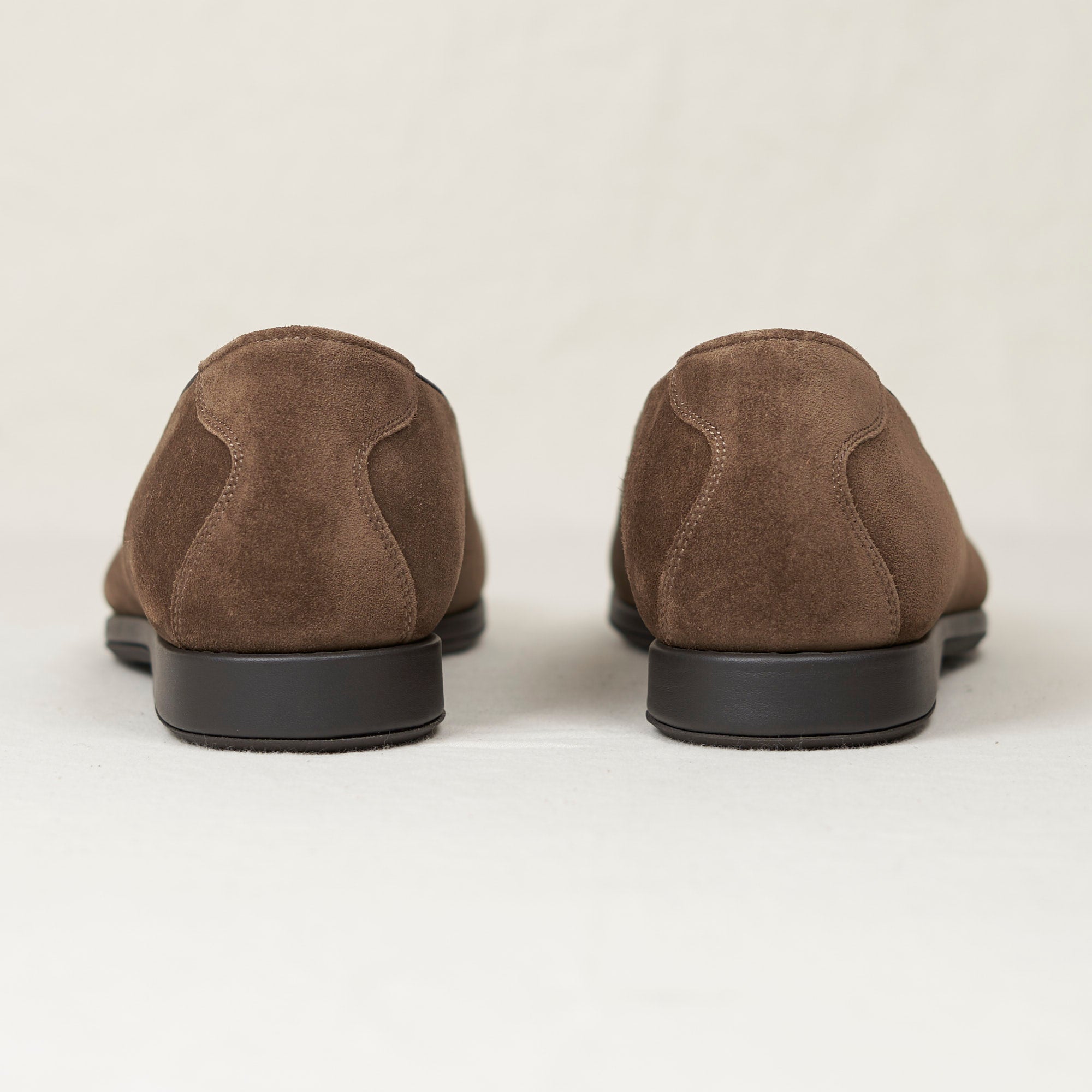 Back view of August Special Augie Type-S walnut calf suede loafer — Blake-stitched rubber outsole and veg-tan leather welt.