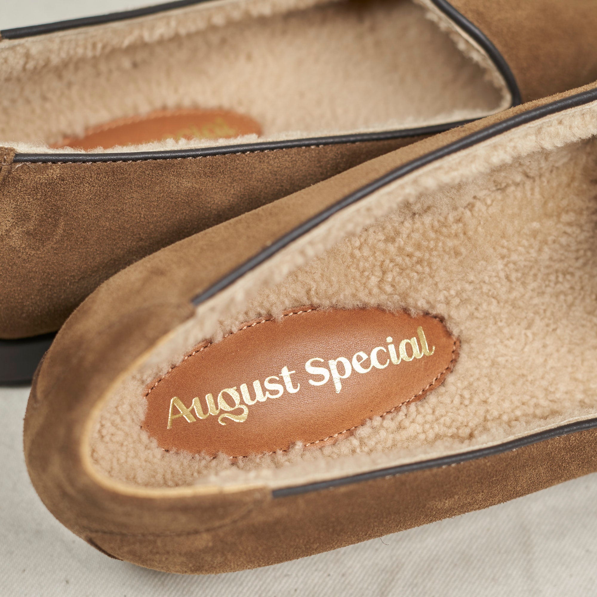 Top-down view of August Special Augie Type-SH walnut suede loafer — shearling lining, hand-sewn vamp stitch, Harry Last.