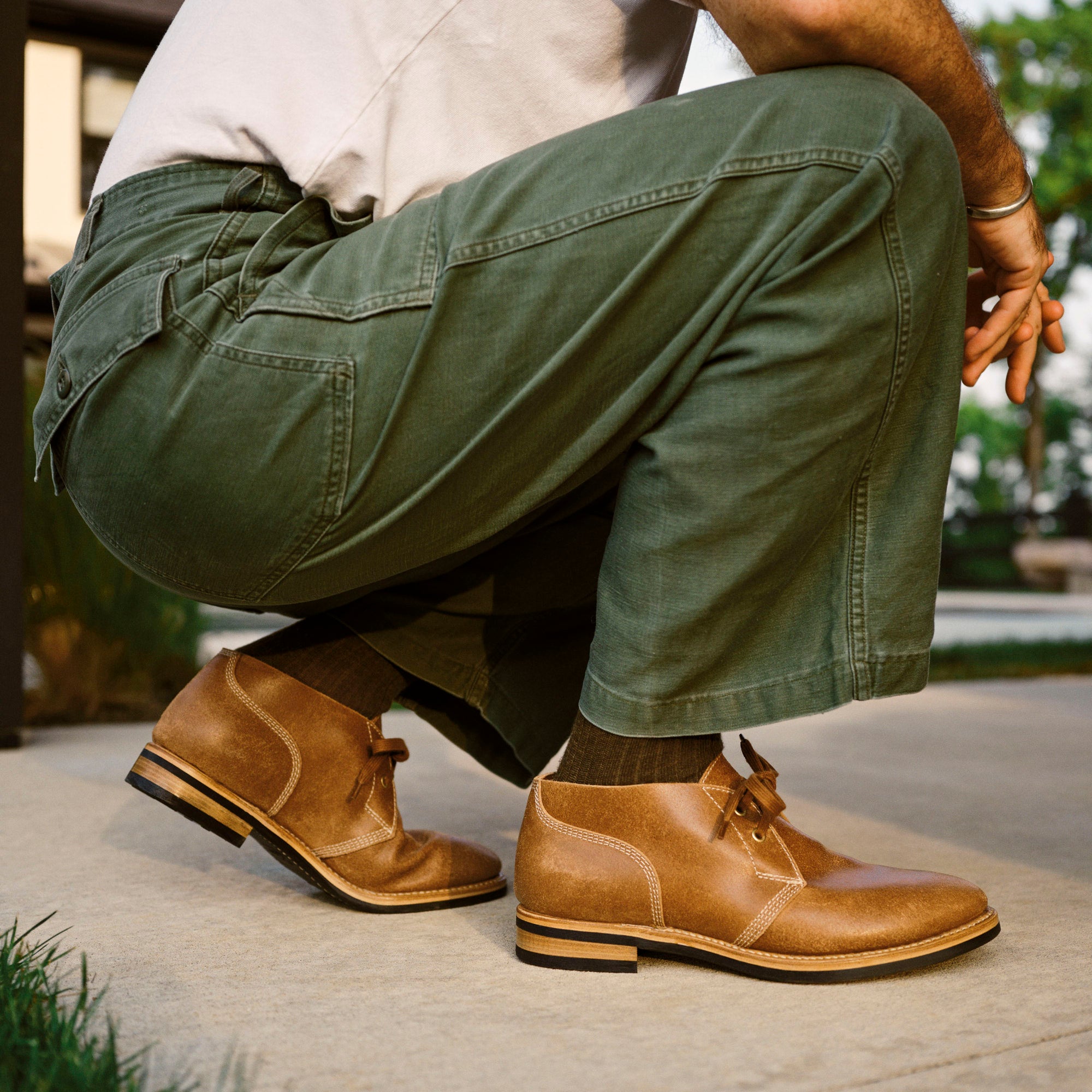 Lifestyle view of August Special Aviator men's roughout suede Goodyear chukka — rugged classic American style.