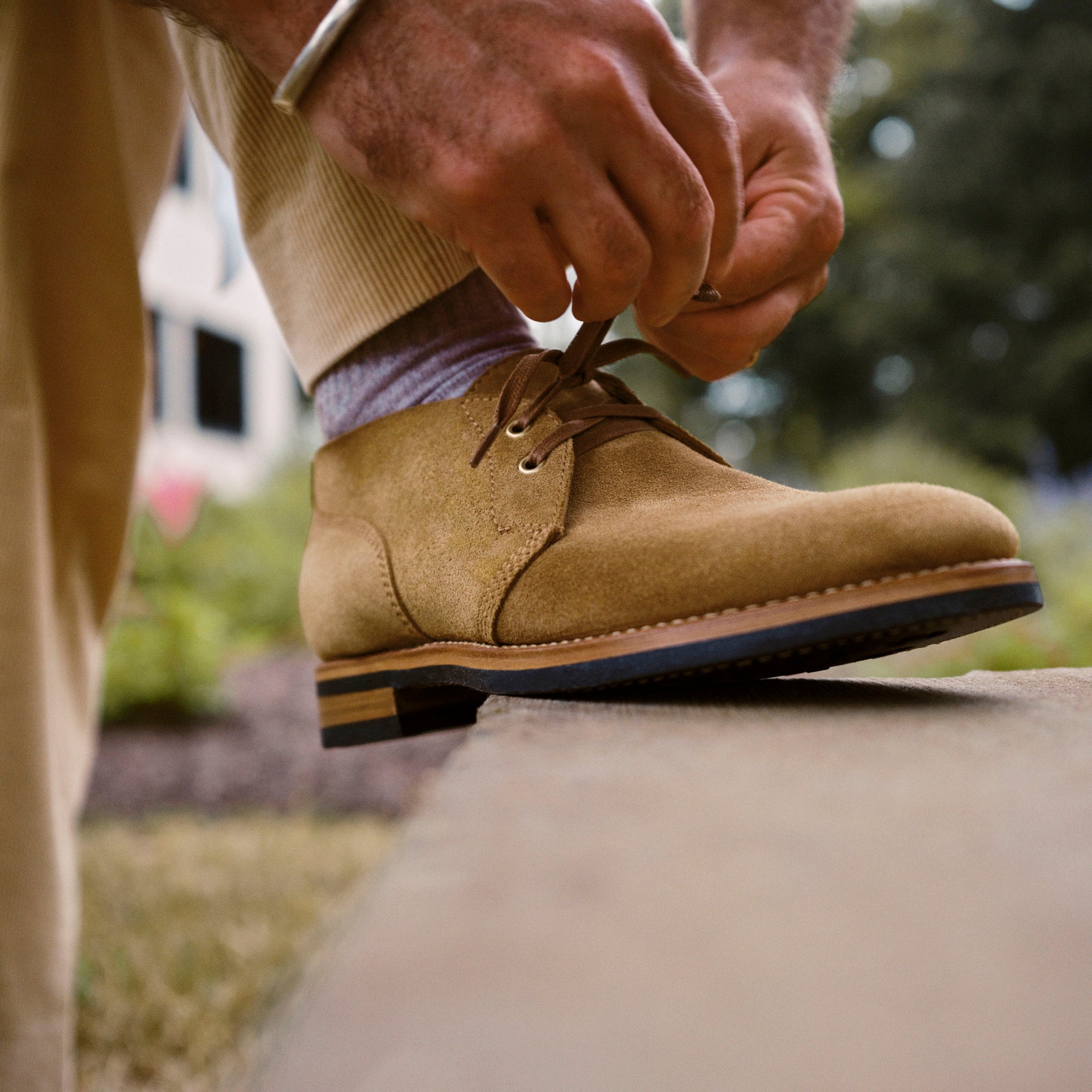 Lifestyle view of August Special Aviator men's veg-tan suede Goodyear chukka — classic American style.