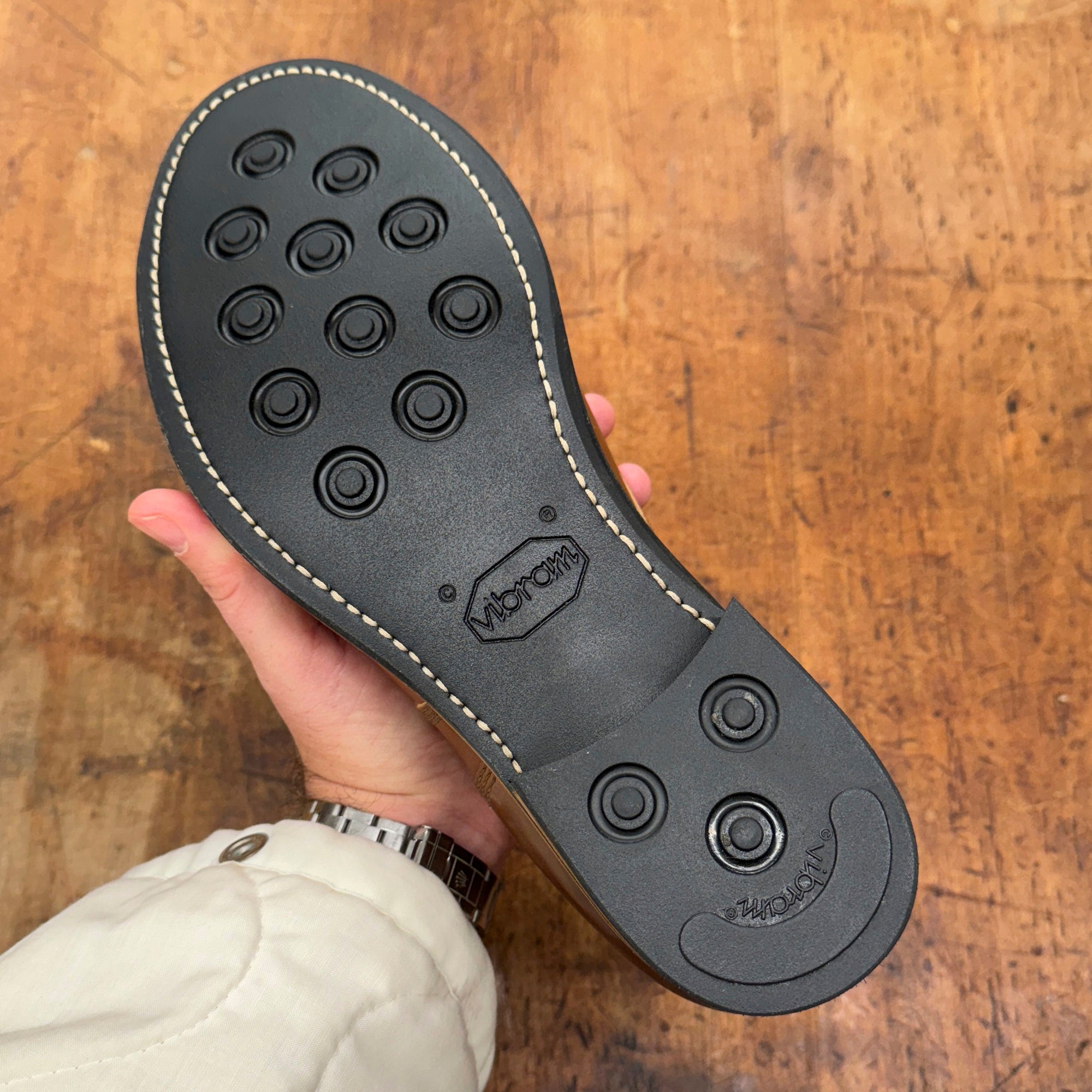 Sole view of August Special Belliver men's vacchetta horsehide boot — Vibram rubber outsole and Goodyear welt. Boot of the Year 2026 awarded by New York Times.