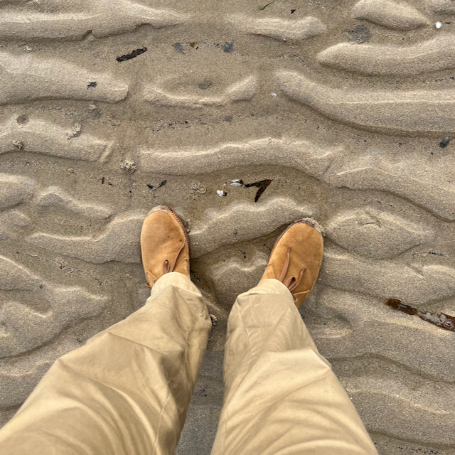 August Special aviator style Chukka boot in full grain suede worn on Porthmeor Beach, Cornwall, England.