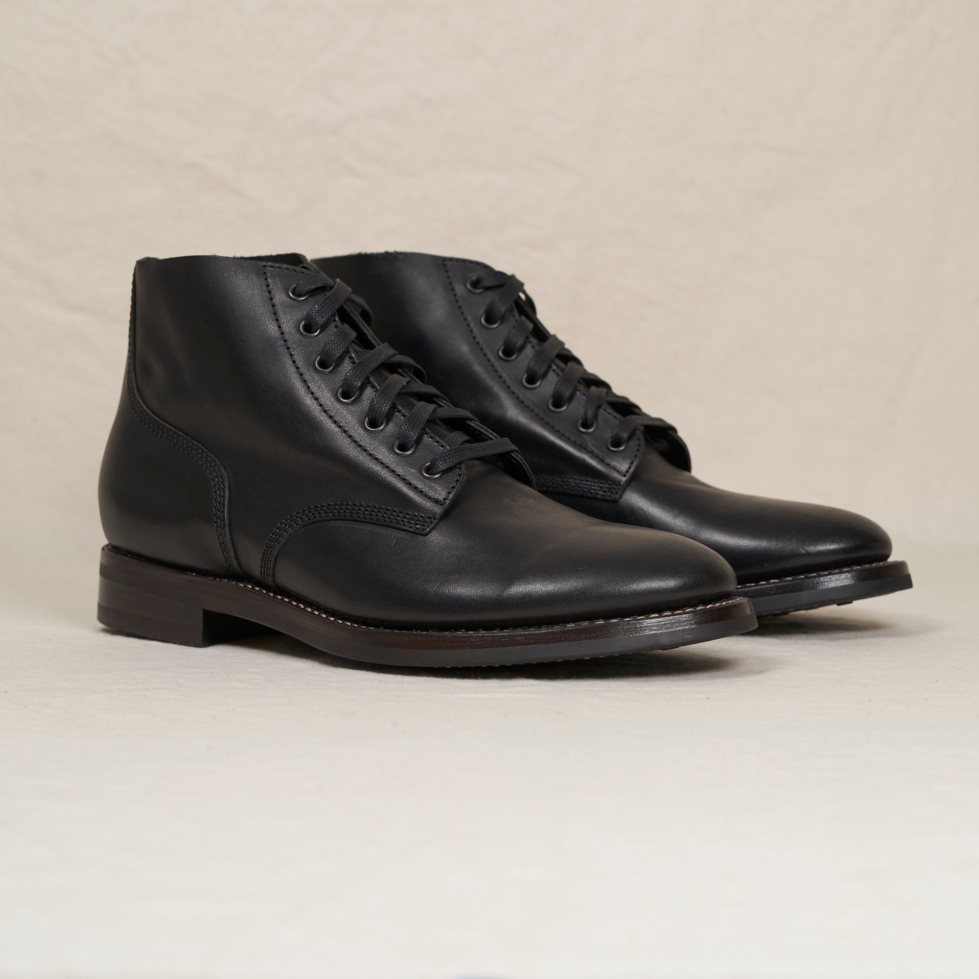 Angled pair of black Belliver boots, featuring classic field-boot lacing and a memory foam padded gusseted tongue.