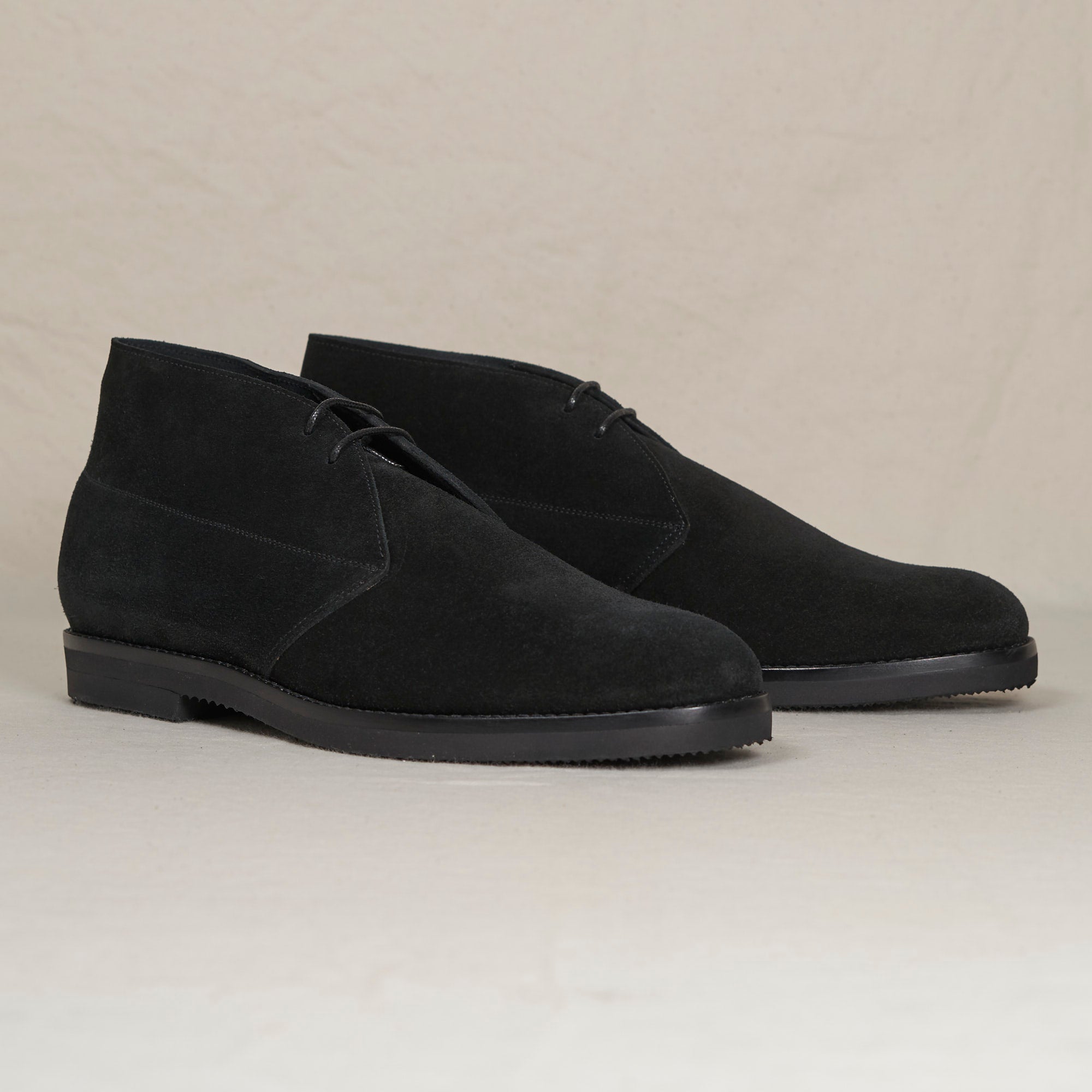Angled view of August Special Voyager black suede Blake chukka — Vibram Gumlite outsole, cushioned Voyager Last.