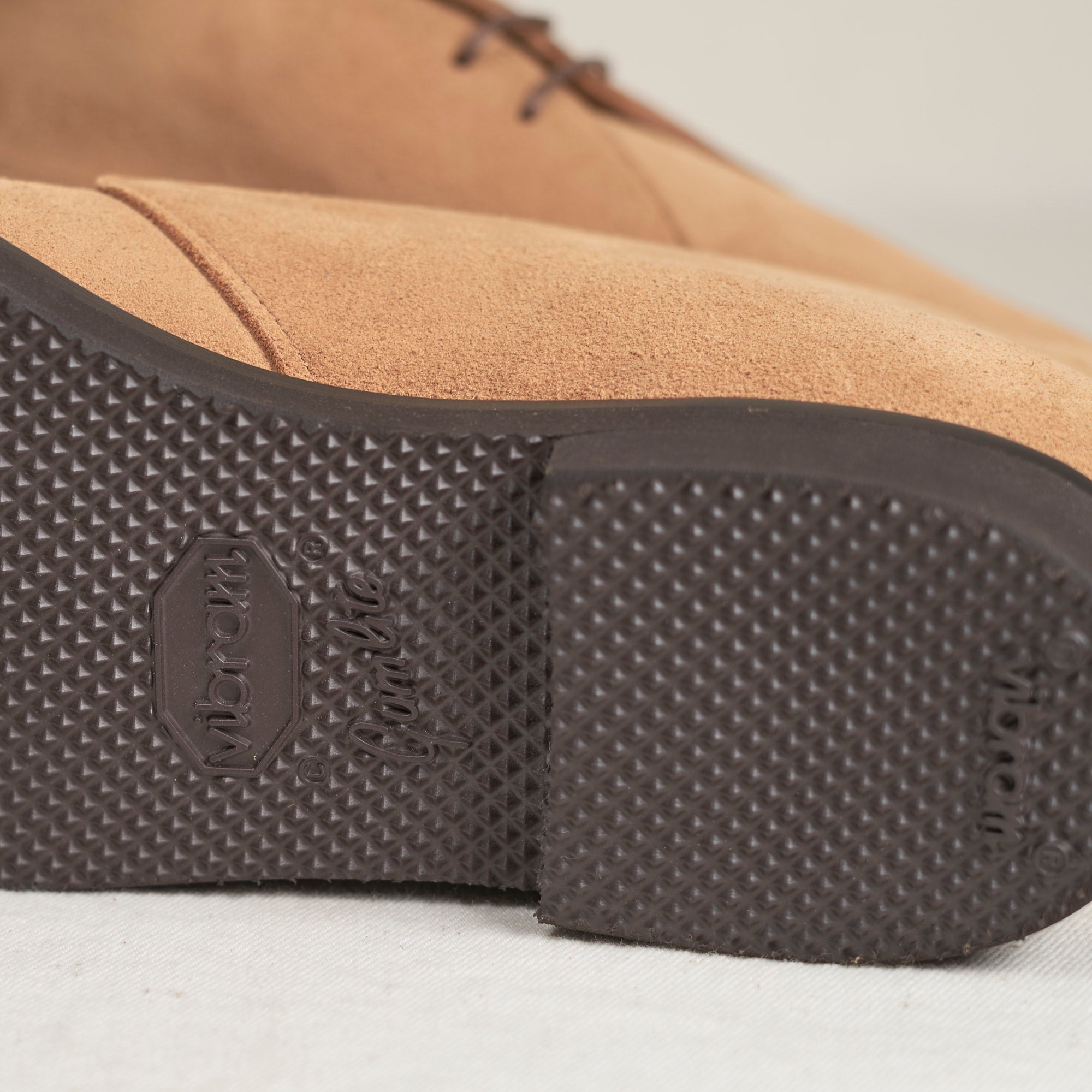 Sole view of August Special Voyager men's caramel suede chukka — slim Voyager Last, classic American silhouette.